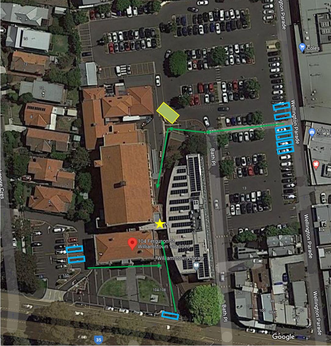 Wide aerial photograph of Williamstown Town Hall depicting accessible car parking spaces in blue, green arrows for accessible pathway in green arrows, yellow and blue cross hatch for drop off point and a yellow star for the accessible entrance