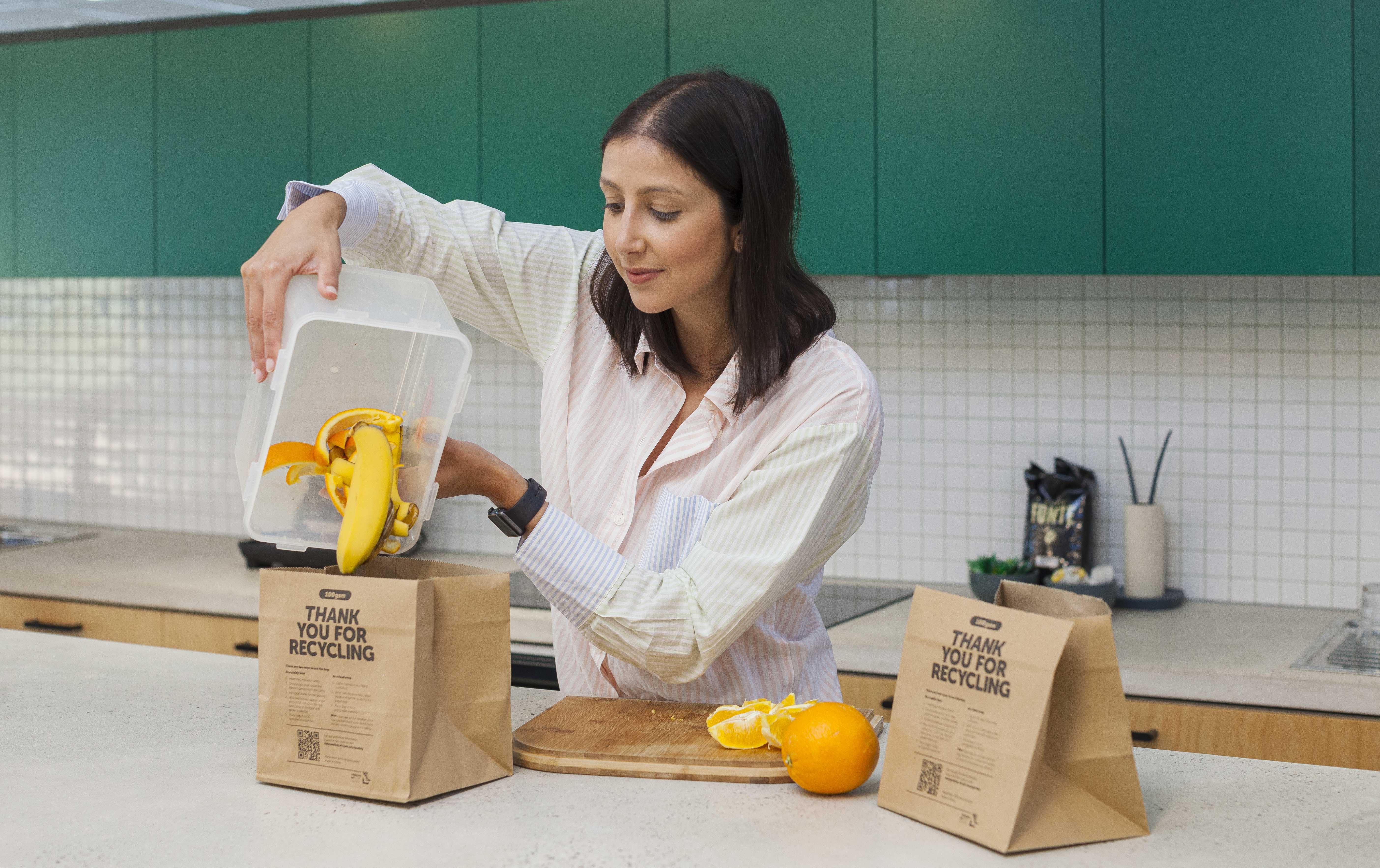 Alana, Altona Meadows resident using a container to collect food scraps and then empty into the Hobsons Bay issued paper bag 